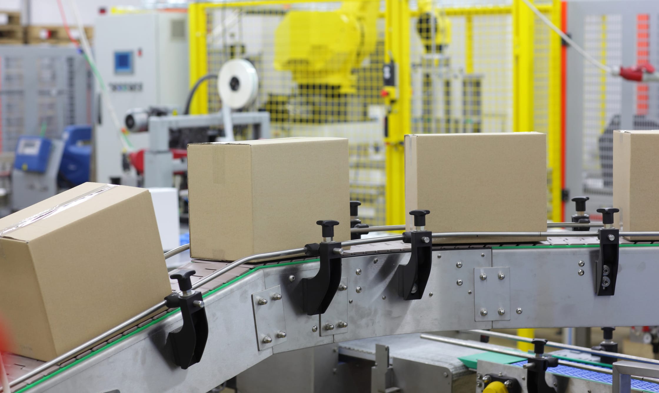 automation - Cardboard boxes on conveyor belt in factory