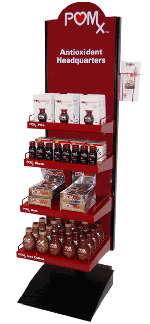 Long red colored shelf with products on it